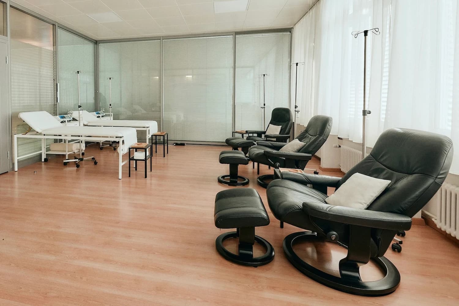 Bright treatment room with reclining chairs